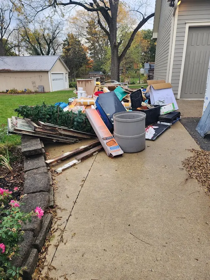 Dumpster being loaded with debris for Roofing Dumpster Rental in Chadron